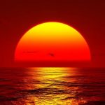 sunset-big-orange-sun-setting-over-ocean